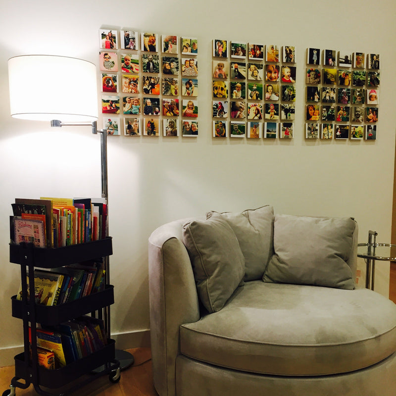 Customer photo wall of Shiner blocks next to a floor lamp