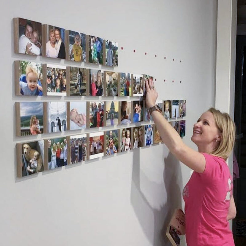 A customer photo wall of Shiner wood blocks
