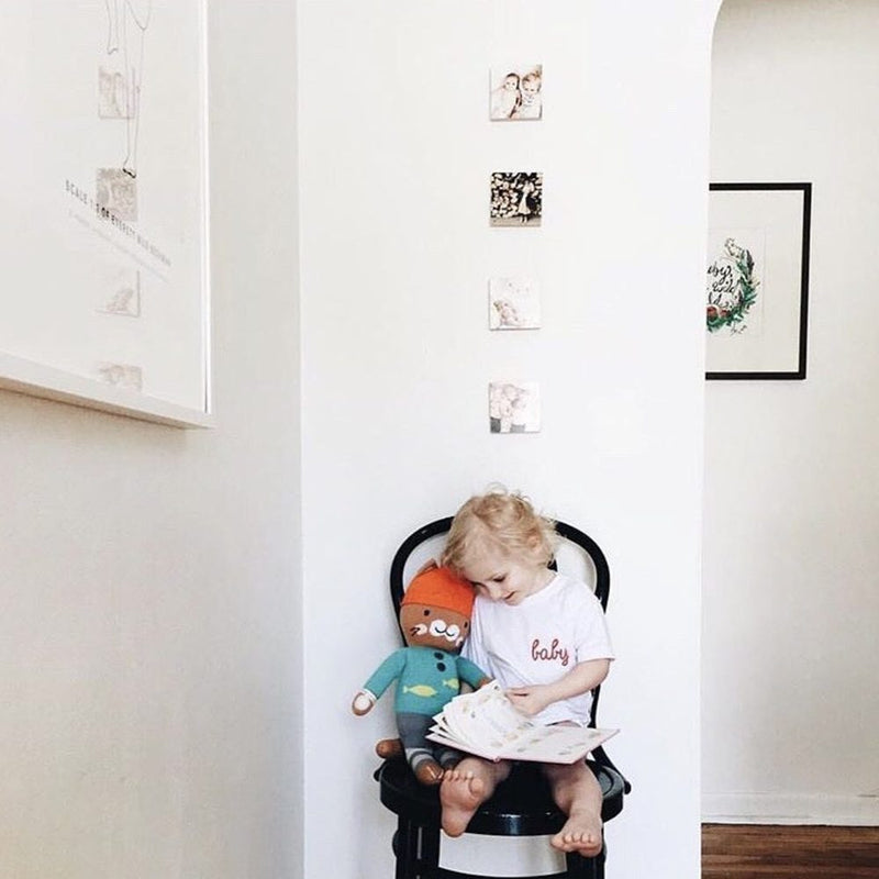 A customer photo wall of Shiner wood blocks